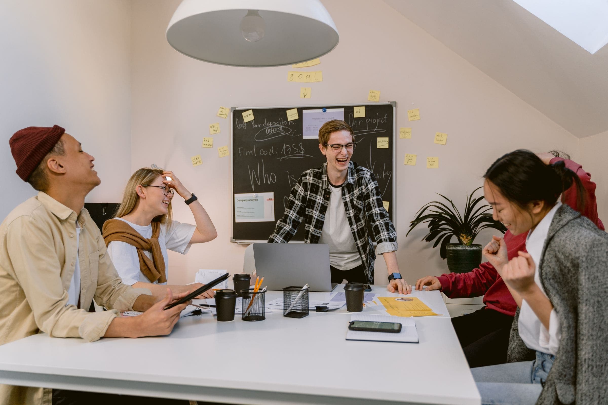 A cheerful team brainstorming together in a bright, modern office